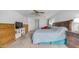 The primary bedroom includes a ceiling fan, dresser, TV stand, and a sitting area at 726 E Rose Marie Ln, Phoenix, AZ 85022
