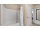 Bathroom shower and tub with white tiled walls and shower curtain at 726 E Rose Marie Ln, Phoenix, AZ 85022