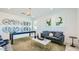 Cozy living room featuring stylish decor, comfortable seating, and ample natural light at 7842 W Tether Trl, Peoria, AZ 85383