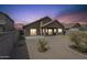 Spacious gravel backyard offering a covered patio and low-maintenance landscape at 7937 W Chickasaw St, Phoenix, AZ 85043