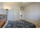 Bright bedroom featuring a neutral color palette, carpet flooring, ceiling fan, and closet at 7937 W Chickasaw St, Phoenix, AZ 85043