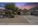 Charming single-story home showcasing desert landscaping and a spacious two-car garage at 7937 W Chickasaw St, Phoenix, AZ 85043