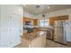 Functional kitchen boasts stainless steel appliances, granite countertops, and ample cabinet space at 7937 W Chickasaw St, Phoenix, AZ 85043