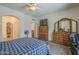 Spacious main bedroom featuring ensuite bathroom, closet and backyard access at 7937 W Chickasaw St, Phoenix, AZ 85043