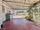 Covered back patio providing a storage area and yard access with view of the spacious, enclosed backyard at 8502 N 26Th Ave, Phoenix, AZ 85021