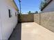 Concrete backyard with block wall and white painted siding at 8502 N 26Th Ave, Phoenix, AZ 85021
