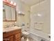 Functional bathroom features a single sink vanity, tiled floors, and shower-tub combination, providing essential comfort at 8502 N 26Th Ave, Phoenix, AZ 85021