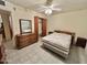 Bedroom showcasing tile flooring, a ceiling fan, and a double door closet at 8502 N 26Th Ave, Phoenix, AZ 85021