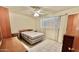 Bedroom featuring tile flooring, a ceiling fan, and bright window at 8502 N 26Th Ave, Phoenix, AZ 85021