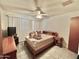 Neutral bedroom featuring tile flooring, ceiling fan, and bright window at 8502 N 26Th Ave, Phoenix, AZ 85021