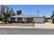 Charming single-Gathering home featuring well-maintained landscaping, a red brick accent, and an attached one car garage at 8502 N 26Th Ave, Phoenix, AZ 85021
