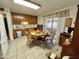 Featuring a cozy kitchen that includes traditional wood cabinetry, tile floors, and access to the outdoor patio at 8502 N 26Th Ave, Phoenix, AZ 85021