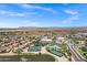 Community aerial view with tennis courts, swimming pool, and nearby shopping at 110 E Saddle Way, San Tan Valley, AZ 85143
