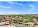 Expansive aerial view of a desert community featuring a golf course and mountain views at 110 E Saddle Way, San Tan Valley, AZ 85143