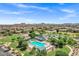 Aerial view of community pool, green spaces, and homes at 110 E Saddle Way, San Tan Valley, AZ 85143
