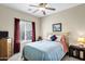 Comfortable bedroom with a large window, soft carpet, and ample natural light at 110 E Saddle Way, San Tan Valley, AZ 85143