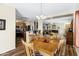 Open dining room with hardwood floors adjacent to kitchen and living areas at 110 E Saddle Way, San Tan Valley, AZ 85143