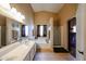 Bathroom features double sinks, soaking tub, and separate glass-enclosed shower with natural light at 11746 W Camino Vivaz --, Sun City, AZ 85373