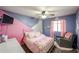 Lovely bedroom with pink accents, bright decor, and ample natural light at 11746 W Camino Vivaz --, Sun City, AZ 85373