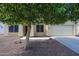 Charming single-story home with a well-manicured front yard and a welcoming entrance, showcasing curb appeal at 11746 W Camino Vivaz --, Sun City, AZ 85373