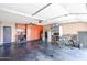 Well-organized garage with ample storage cabinets, workspace, and room for multiple vehicles and equipment at 11746 W Camino Vivaz --, Sun City, AZ 85373