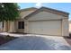 Attached two-car garage with a concrete driveway and manicured desert landscaping at 11746 W Camino Vivaz --, Sun City, AZ 85373