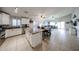 Open-concept kitchen featuring an island, modern appliances, and seamless flow to the living area at 11746 W Camino Vivaz --, Sun City, AZ 85373