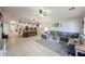 Inviting living area featuring an open floor plan connecting the kitchen, dining, and living spaces at 11746 W Camino Vivaz --, Sun City, AZ 85373