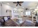Well-lit living space with contemporary decor, comfortable seating, and access to other rooms at 11746 W Camino Vivaz --, Sun City, AZ 85373