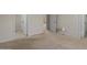Spacious bedroom featuring neutral carpet, white walls, and doors at 1402 E Guadalupe Rd # 215, Tempe, AZ 85283