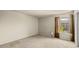 Spacious bedroom featuring neutral carpet, a window with privacy blinds, and closet access at 1402 E Guadalupe Rd # 215, Tempe, AZ 85283