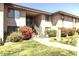 Inviting two-story condo with well-maintained landscaping and stair access to upper units at 1402 E Guadalupe Rd # 215, Tempe, AZ 85283