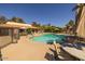 Community pool with lounge chairs and umbrellas, perfect for relaxation at 1402 E Guadalupe Rd # 215, Tempe, AZ 85283