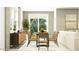 Cozy dining area with a modern table, chairs, stylish buffet, and lots of light at 14930 W Buckskin Trl, Surprise, AZ 85387