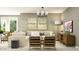 Bright living room featuring stylish furnishings, neutral decor, and ample natural light at 14930 W Buckskin Trl, Surprise, AZ 85387