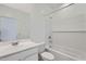 Bright, modern bathroom with a large mirror and subway tile surround in the tub/shower at 15018 W Buckskin Trl, Surprise, AZ 85387