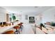 Open-concept living area with kitchen island, stylish seating, and a TV at 15018 W Buckskin Trl, Surprise, AZ 85387