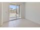 Bright room with sliding glass doors and tiled floor with access to outdoor area at 15018 W Buckskin Trl, Surprise, AZ 85387