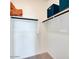 A clean and organized walk-in closet with shelving, hanging rods, and ample storage space at 15018 W Buckskin Trl, Surprise, AZ 85387