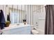Chic bathroom with a sleek vanity, a soaking tub, and stylish decor for a luxurious and relaxing experience at 15060 W Hackamore Dr, Surprise, AZ 85387