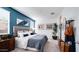 Serene main bedroom with elegant decor, large windows, and refined furniture arrangement for relaxation at 15060 W Hackamore Dr, Surprise, AZ 85387