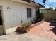 Backyard with brick detail, small garden, and access to home at 1718 E Gaylon Dr, Tempe, AZ 85282