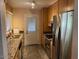 Galley kitchen with stainless steel appliances, granite counters and bright natural light at 1718 E Gaylon Dr, Tempe, AZ 85282