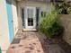 Private outdoor patio featuring a brick floor, privacy wall, and door to the house at 1718 E Gaylon Dr, Tempe, AZ 85282