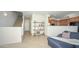 Open living area with staircase, display shelving and tiled floors providing an inviting atmosphere at 1851 W Vermont Ave, Phoenix, AZ 85015