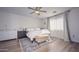 Bright main bedroom with natural light and a cozy rug underneath a king-sized bed at 1851 W Vermont Ave, Phoenix, AZ 85015
