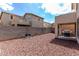 Low maintenance backyard with desert landscaping and a covered patio area perfect for grilling at 18525 W Valerie Dr, Surprise, AZ 85374