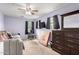 A cozy secondary bedroom showcasing a daybed, a window, and carpet flooring at 18525 W Valerie Dr, Surprise, AZ 85374