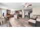 Open floor plan kitchen features a center island, laminate floors, and stainless steel appliances at 18525 W Valerie Dr, Surprise, AZ 85374