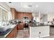 Bright kitchen showcasing granite countertops, stainless appliances, and laminate floors at 18525 W Valerie Dr, Surprise, AZ 85374